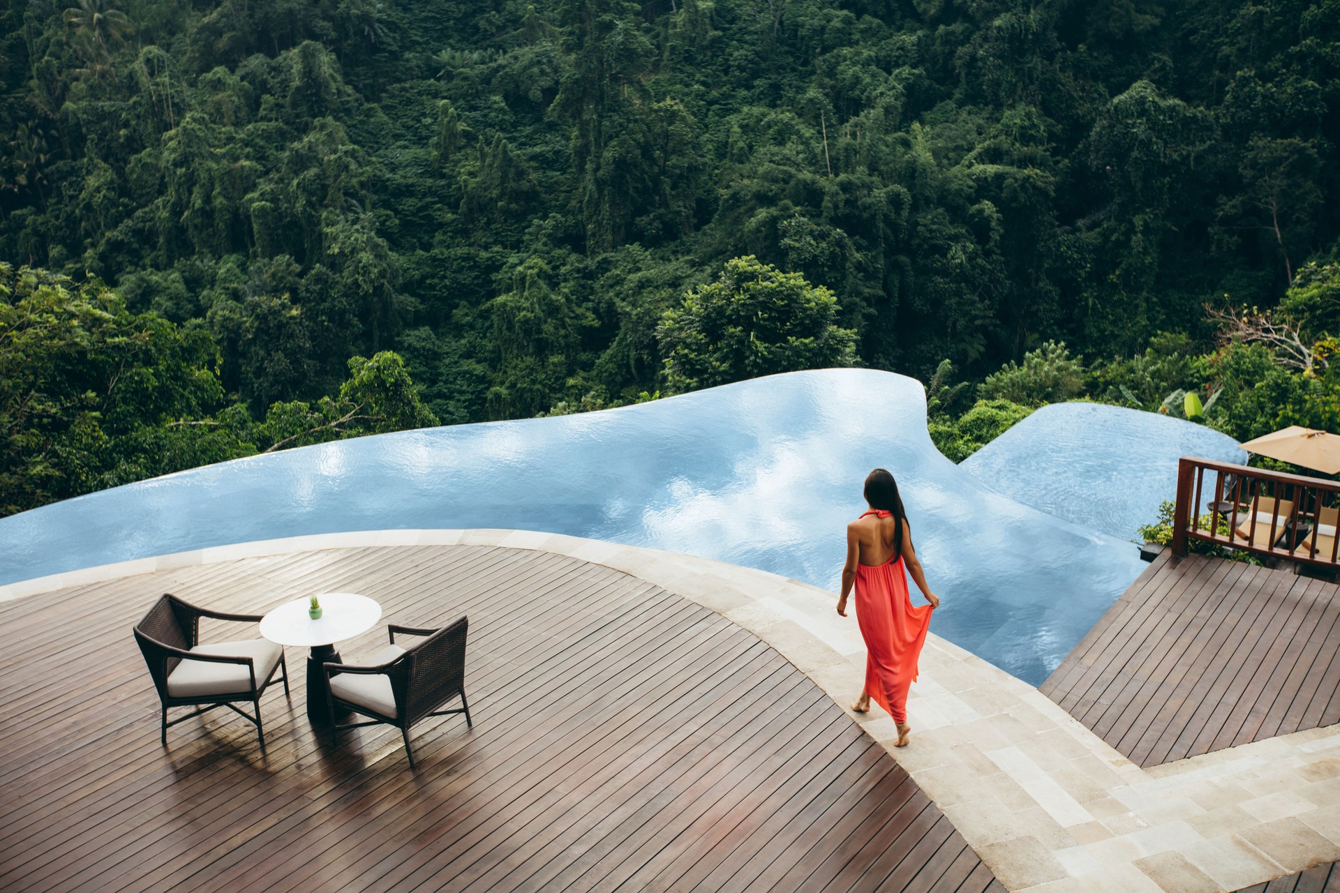 Woman at luxury resort poolside