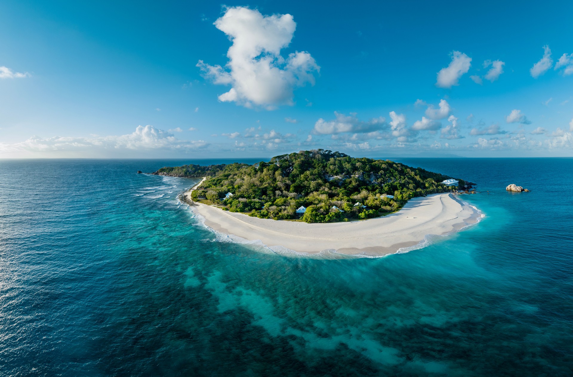 Aerial view of a tropical paradise luxury resort on Cousine Island, villas and private beach, Seychelles